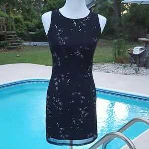 Black dress w/ silver sparkles. Little black dress
